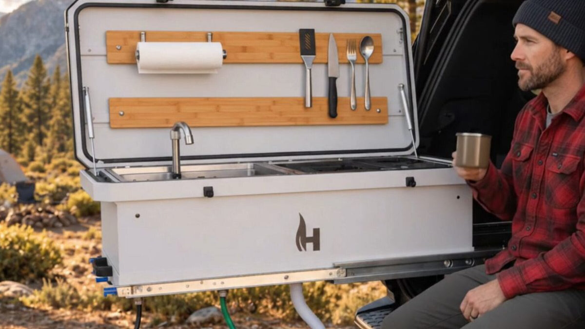 Camp Kitchen Slideout with lid open showing burners, sink, and prep space